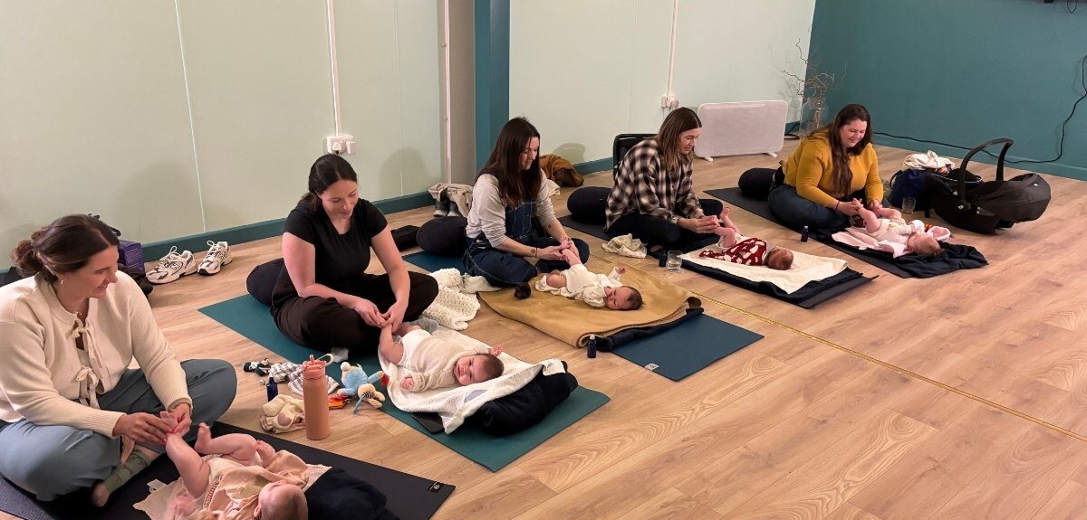 Babies being massage by their mums, as part of a baby massage class. One of the many classes, courses and wellbeing events in Wellington Somerset